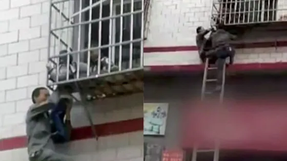 Salvan a un niño colgado de la cabeza en un balcón (Video)